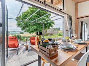 a dining room with a table and a large window at 2 Bed in Llandrindod Wells oc-53193 in Llandrindod Wells
