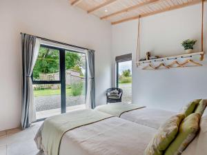 a bedroom with two beds and a large window at 2 Bed in Llandrindod Wells oc-53193 in Llandrindod Wells