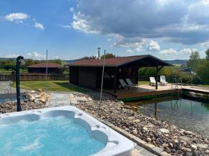 a hot tub in a yard with a gazebo at Birkholmhof in Bärnau