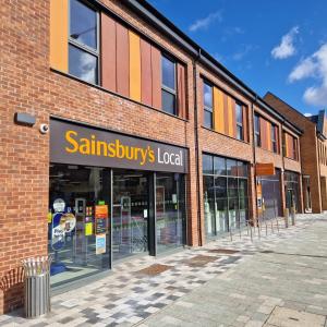 a sainsburys local store in a brick building at Nairn Way House in Kirby Muxloe