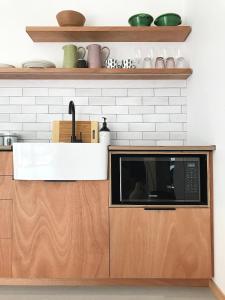 a kitchen with a sink and a microwave at New Dawn luxury homes in Nairobi