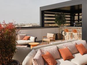a living room with couches and a view of a city at Il Leon D'Oro Bari - by Farace Hotels in Bari