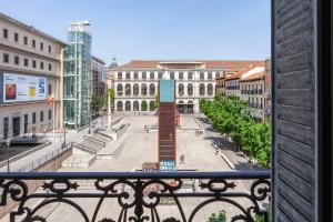 a view of a city square from a balcony at Hotel Mediodia in Madrid