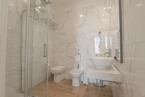 a bathroom with a toilet and a sink and a shower at B&B Sikelia Suite in Agrigento +28 photos