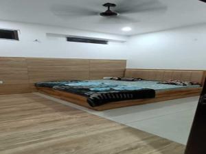 a bedroom with a large bed in a room at Hotel Maa Karni Darbar in Deshnoke