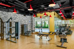 a gym with several treadmills and cardio machines at Royal Garden Beach Hotel in Konaklı