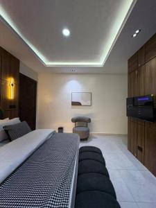 a hotel room with a bed and a television at JKB APARTMENt in Lekki