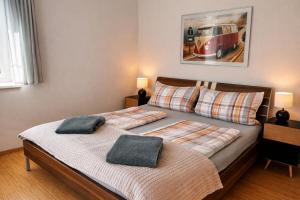 two beds in a bedroom with two pillows on them at Apartment Ausseerland - willkommen bei Freunden in Bad Aussee