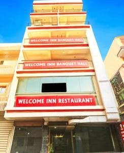 a building with a sign that reads welcome inn banquet hall at Hotel welcome inn in Patna