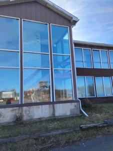 a building with a lot of windows on the side of it at Maplehurst Motel in Tunkhannock