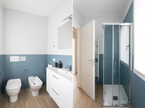 a bathroom with a toilet sink and a shower at Maison Bellini 1 in Toscolano Maderno +40 photos