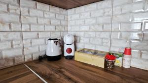 a kitchen with two appliances sitting on a counter at HTH Apartments in Center of Gjakova - 4th Floor in Gjakove