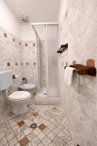 a bathroom with a toilet and a shower at Hotel Portacavana in Trieste +26 photos