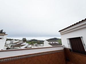 a view from the balcony of a white building at Casa Miguelín in Montecorto