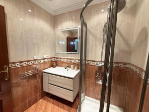 a bathroom with a sink and a shower at Casa Miguelín in Montecorto +42 photos