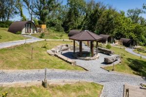 a playground with a gazebo in a park at Pods @ Broadway in Laugharne