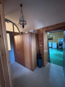 a room with a cupboard and a door to a room at Dai Nonni Vacation Home in Acciano