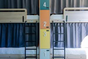 two bunk beds next to each other in a room at SLO HOSTEL Bordeaux in Bordeaux