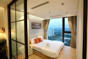a bedroom with a bed with a teddy bear on it at Maison de Ecopark - Onsen & Spa in Kim Quan +48 photos