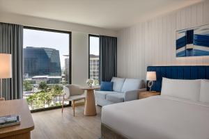a hotel room with a bed and a couch at Crowne Plaza Yas Island by IHG in Abu Dhabi