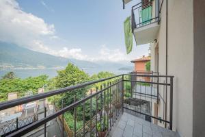 a balcony with a view of the water at Castelaus, Lake view, 1 Min Walk from the Lake in Dervio