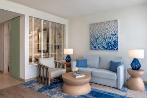 a living room with a couch and a chair at Crowne Plaza Yas Island by IHG in Abu Dhabi