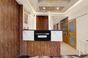 a lobby with a sign that says townhouse gym at Super Townhouse Oak Arvindo Park Indira Nagar Formerly Rama Inn in Vibhuti Khand