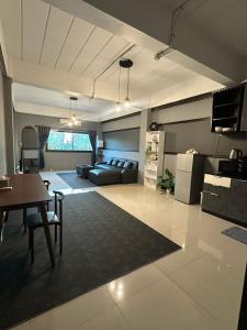 a living room with a couch and a table at Vera House in North Pattaya