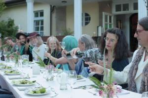 a group of people sitting at a table eating food at Seegut Blaue Blume in Buchenhain +27 photos