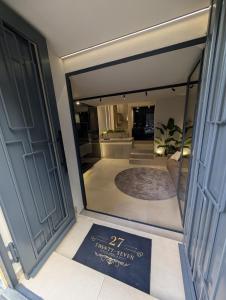 a reflection of a room with a sign in a mirror at Twentyseven Luxury Suite in Catania