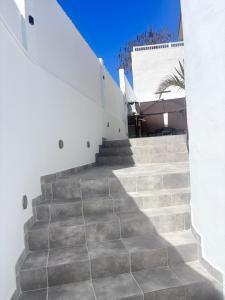 a set of stairs leading up to a building at ViLLA DANEIRA LUX in Mogán