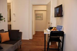 a living room with a table and a couch at Dimora San Giorgio in Bolsena in Bolsena