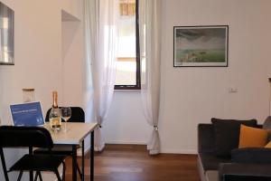 a living room with a table and a window at Dimora San Giorgio in Bolsena in Bolsena +26 photos