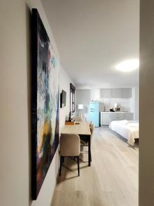 a living room with a dining room table and a bedroom at Premium Luxury Muralla de Lugo 2.3-A in Lugo