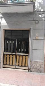 a door of a building with a bunch of windows at Casa bea in Taranto