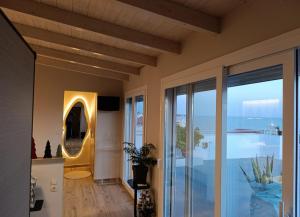 a living room with a view of the ocean at VueSurMer Amarynthos in Amarynthos