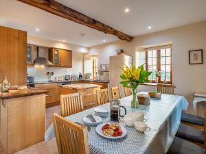 a kitchen with a table with food on it at 8 Bed in Llanigon oc-bn241 in Llanigon