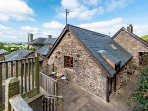 an image of a stone cottage with a balcony at 8 Bed in Llanigon oc-bn241 in Llanigon