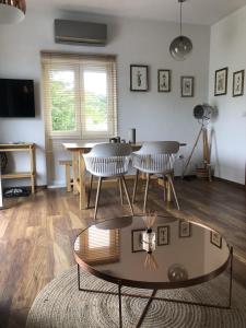a living room with a coffee table and chairs at Sokograd Entire House in Šipovo