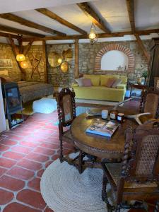 a living room with a couch and a table at Sokograd Entire House in Šipovo