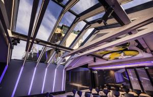 a group of chairs in a room with windows at Scalaria Sunset Wing in St. Wolfgang