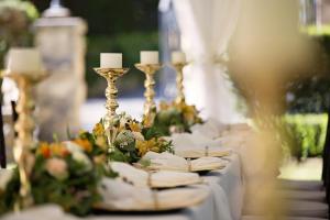 a table with white plates and candles and flowers at Radisson Resort Ruza Vjetrova in Dobra Voda +96 photos