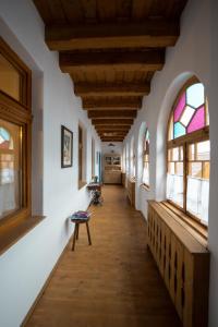 a hallway in a house with stained glass windows at Azuria Viscri in Viscri