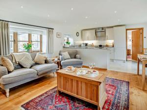 a living room with a couch and a table at 1 Bed in Chepstow oc-91941 in Chepstow