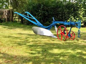 a blue and red playground equipment in the grass at 1 Bed in Chepstow oc-91941 in Chepstow