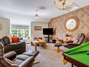 a living room filled with furniture and a pool table at 5 Bed in Machynlleth oc-92513 in Machynlleth
