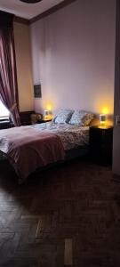 a bedroom with a bed with two pillows on it at Résidence Bayard in Dinant