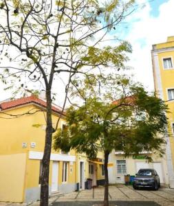 a car parked in a parking lot next to a building at Stay DP Setúbal in Setúbal