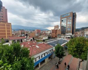 a view of a city with buildings and trees at El Encanto in Duitama