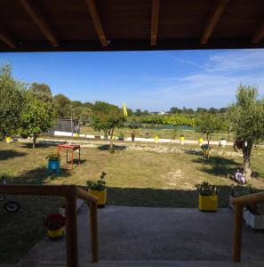 a view of a park with trees and a field at Farma Giannis in Sarti